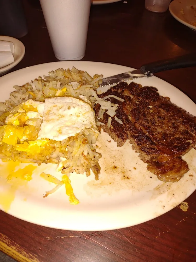 Steak Hash Brown Potatoes with over Easy Eggs